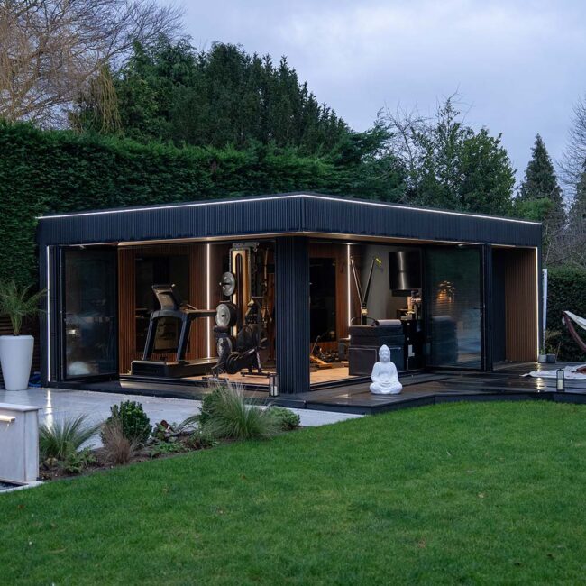The Autobiography 30 m² garden room with gym beside a swimming pool